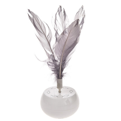 Electric pet tumbler feather cat toy spinning and balancing on indoor floor