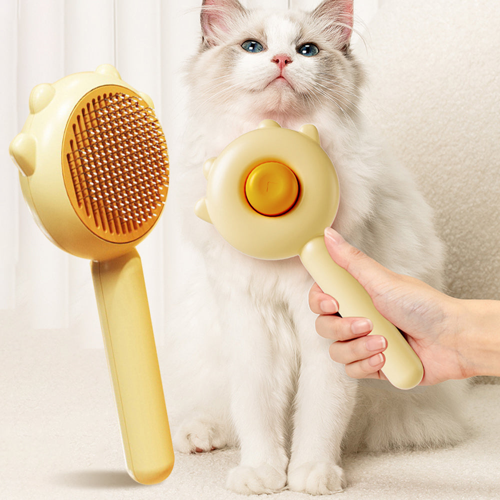 Pet grooming massage comb removing loose fur from a cat coat