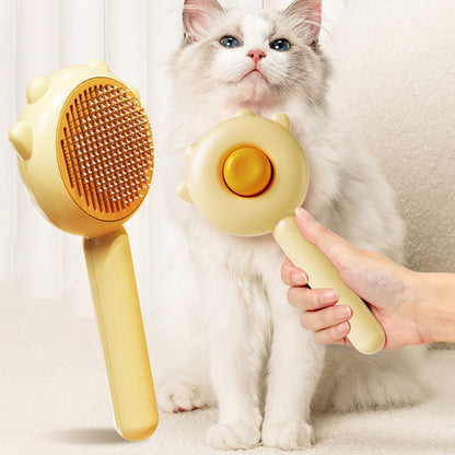 Pet grooming massage comb removing loose fur from a cat coat