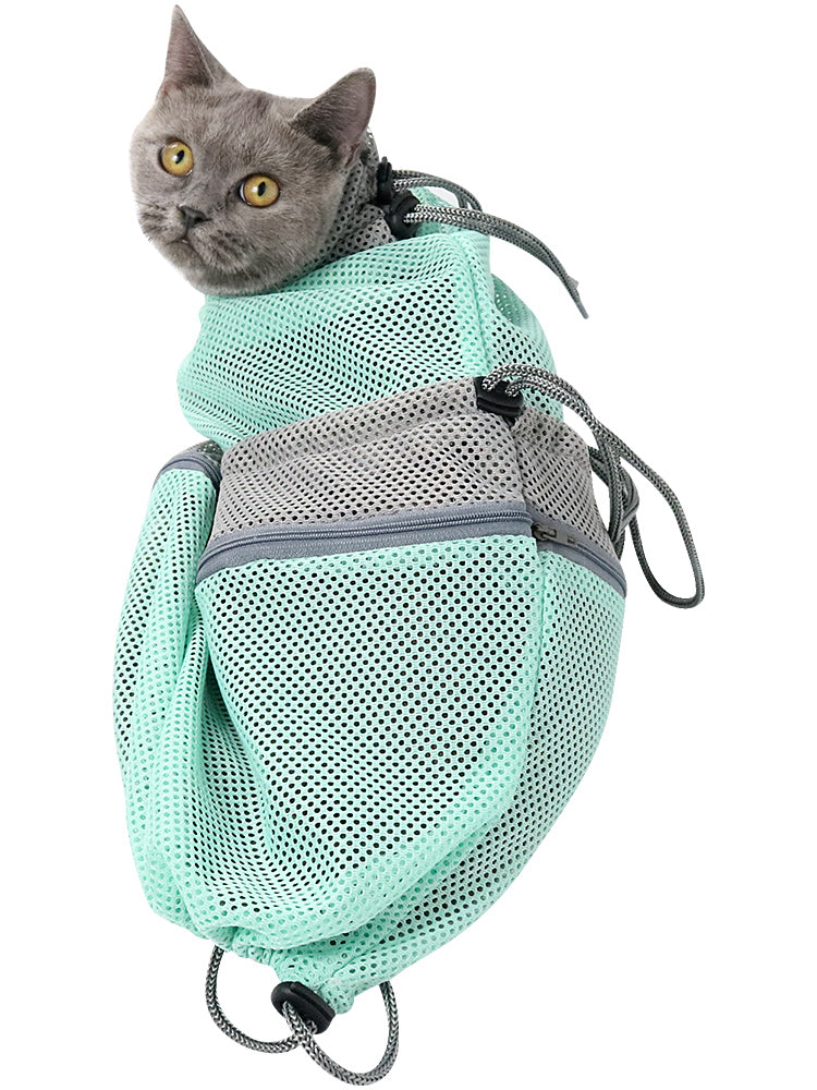 Scratch proof mesh grooming and bathing cat bag positioned for cat nail trimming